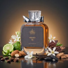 Perfume bottle labeled 'Velvet 55' surrounded by flowers, fruits, and spices on a reflective surface.