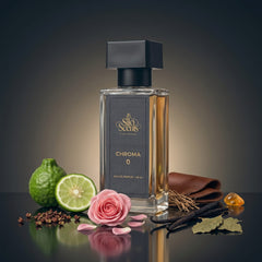 Perfume bottle labeled 'Silo Scents Chroma 0' with limes, a rose, and vanilla beans on a reflective surface.